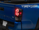 Raxiom 16-23 Toyota Tacoma XW Series Sequential LED Tail Lights- Black Housing- Clear Lens